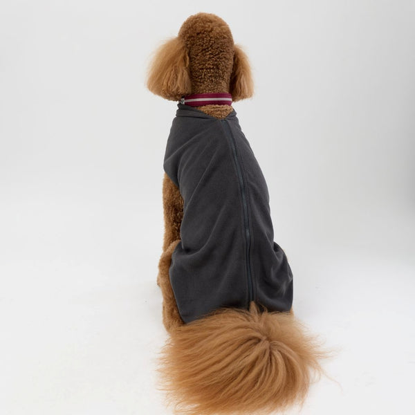 A large dog wearing a Snoot Style Fleece Dog Coat.