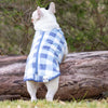A French Bulldog in the park wearing a Snoot Style Fleece Dog Coat.